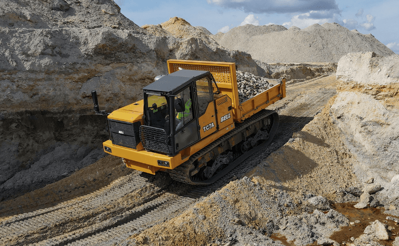 A Tracked Carrier moving through a worksite