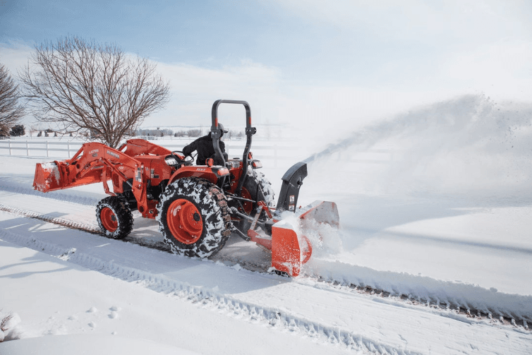 Tractor with snow blower implement