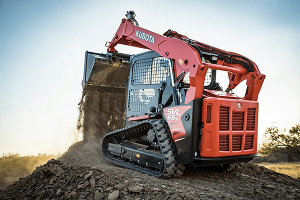 Kubota SVL65 parked on a dirt pile