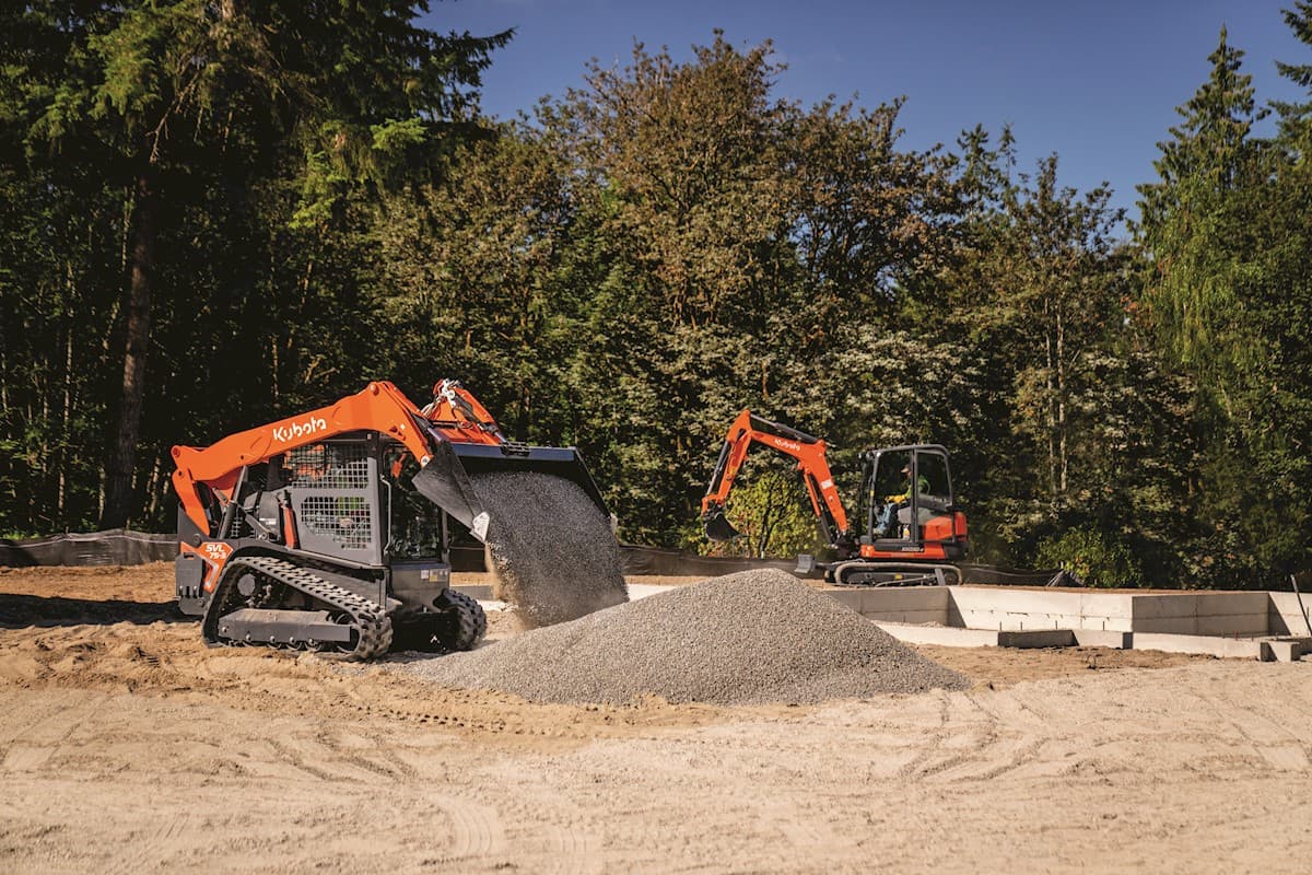 SVL75 dumping dirt at a construction site