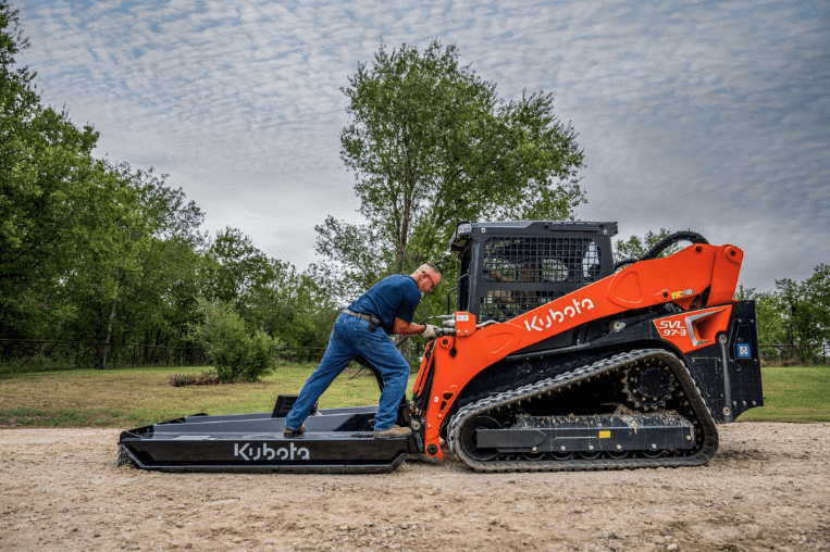 Man getting into his track loader