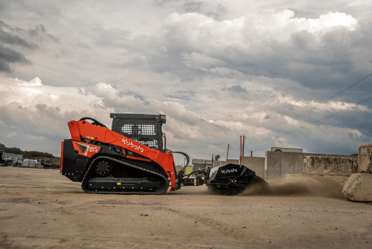 Track Loader with sweeper attachment