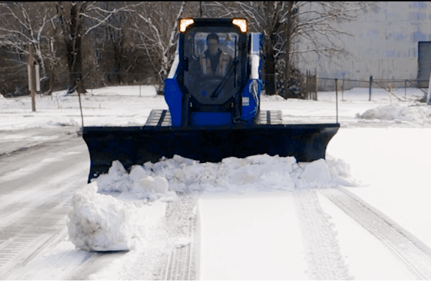 Blue diamond snow plow in action
